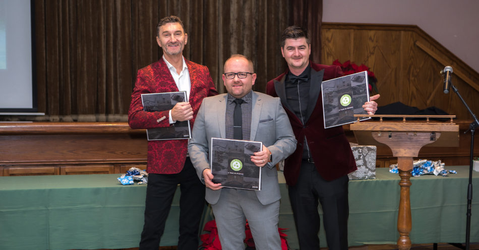 Yearbooks presented to Peter, John, and Matt in 2019