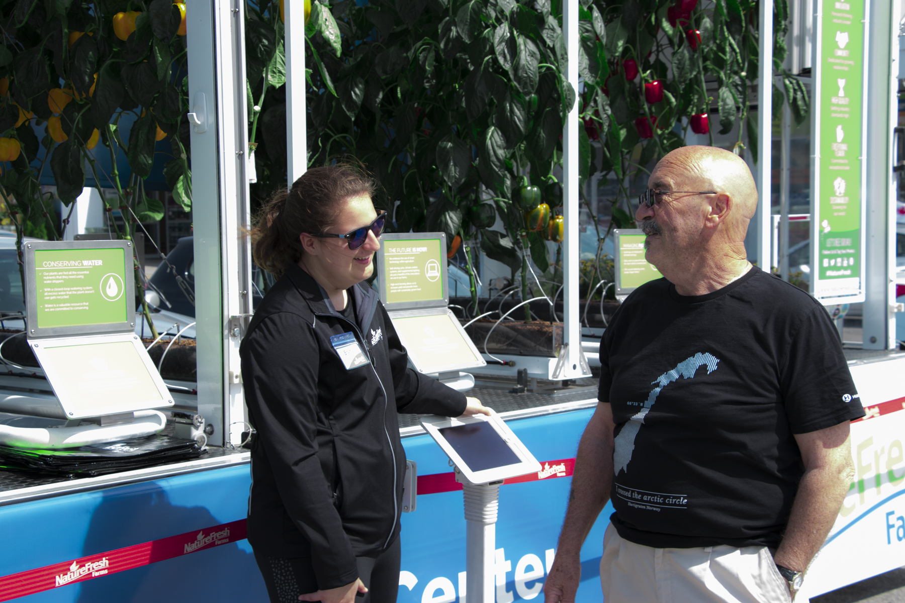 Bryn speaking with a consumer at the GEC