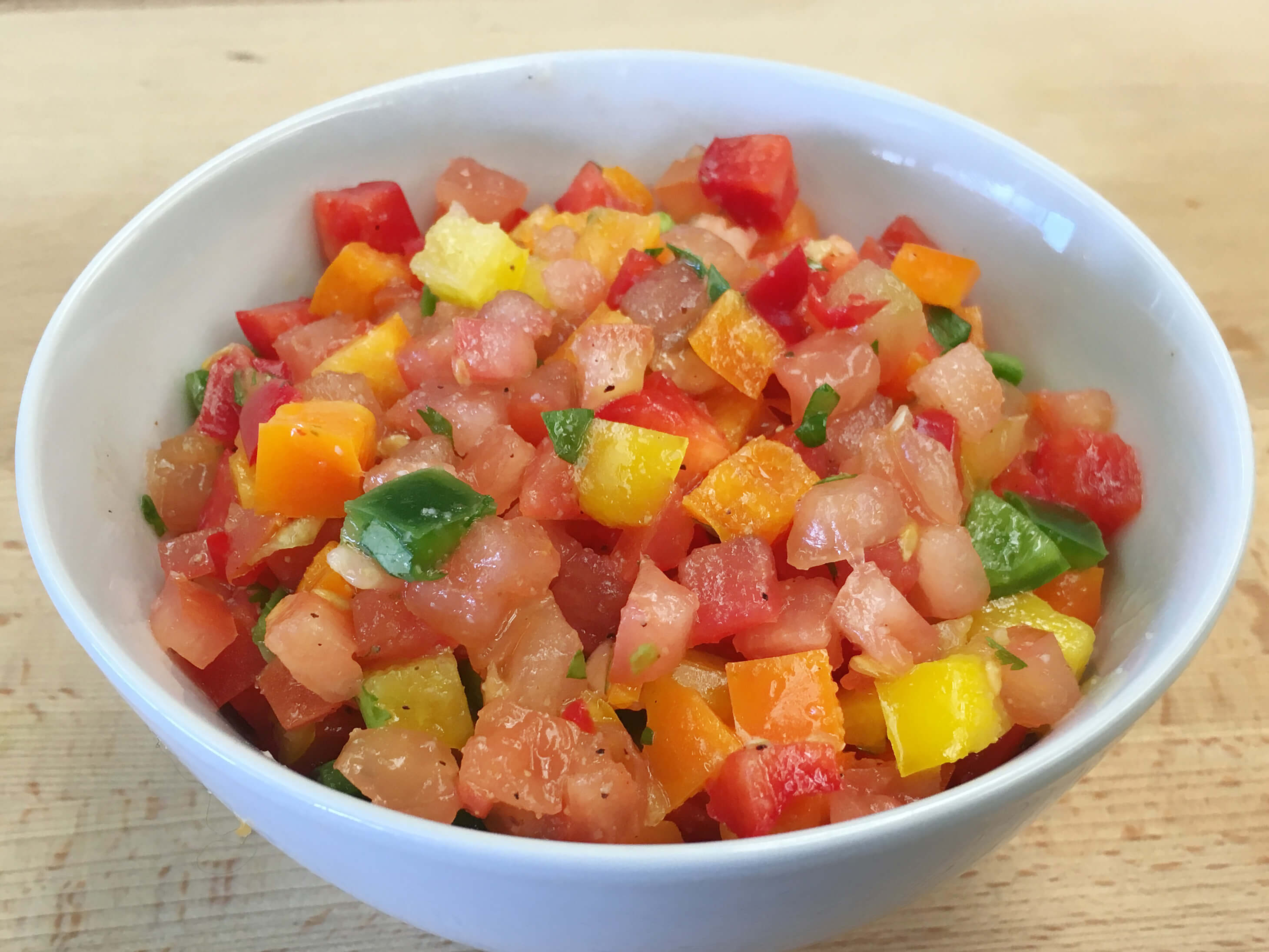 Spice up your taste buds with this amazing flavor combination of sweet heat! This salsa is great as a topping for any grilled meat or fish!