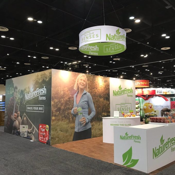 NatureFresh Farms booth at a convention centre.