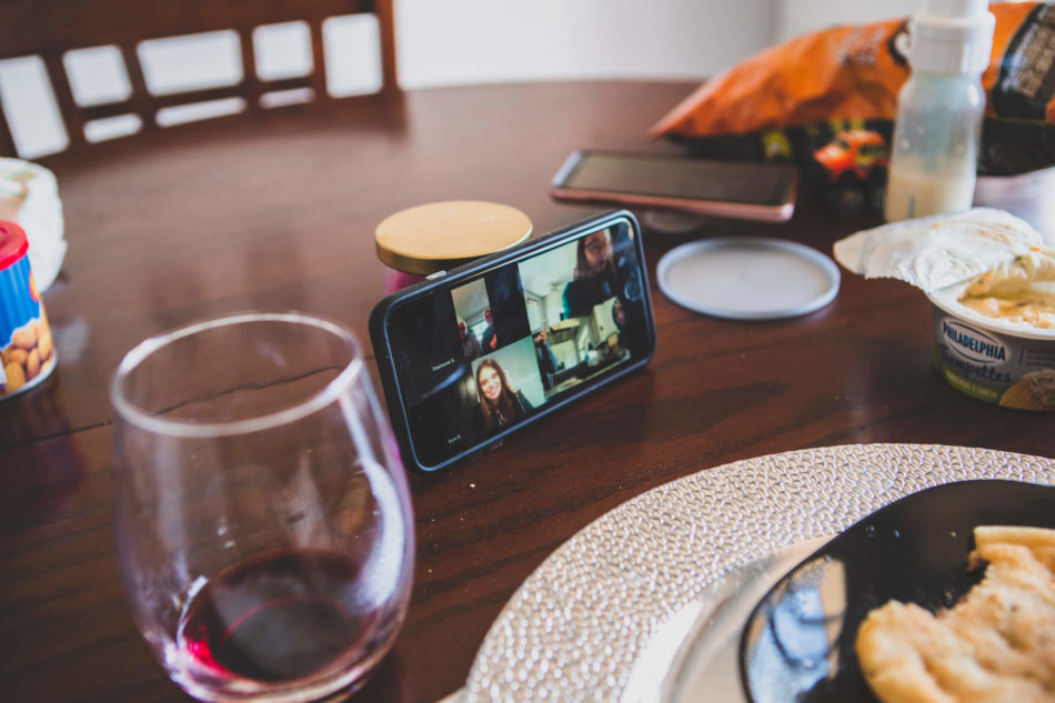 Virtual dinner party with friends calling each other over video chat