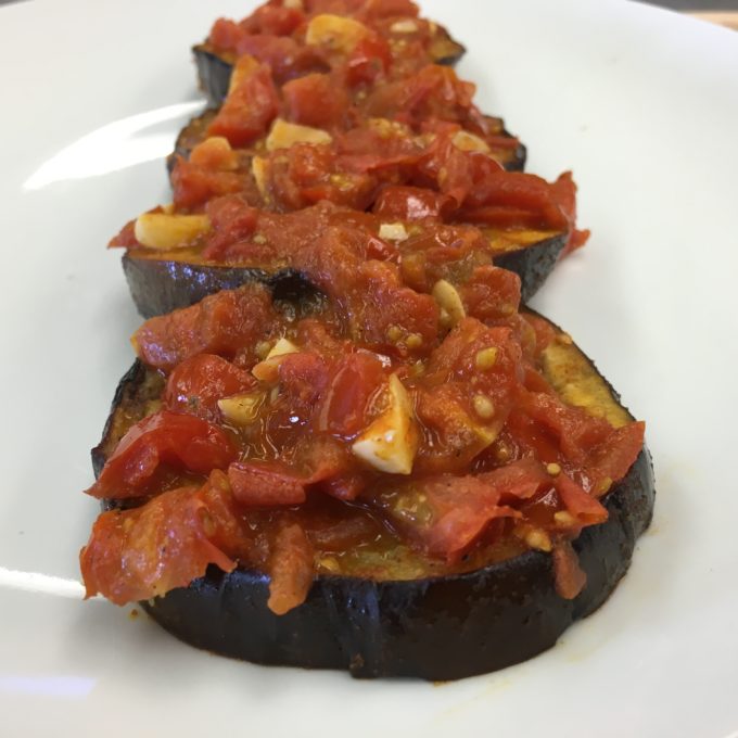 A traditional Middle Eastern eggplant dish topped with NatureFresh™ Farms quintessential Italian plum tomato, the Roma! So much flavor!